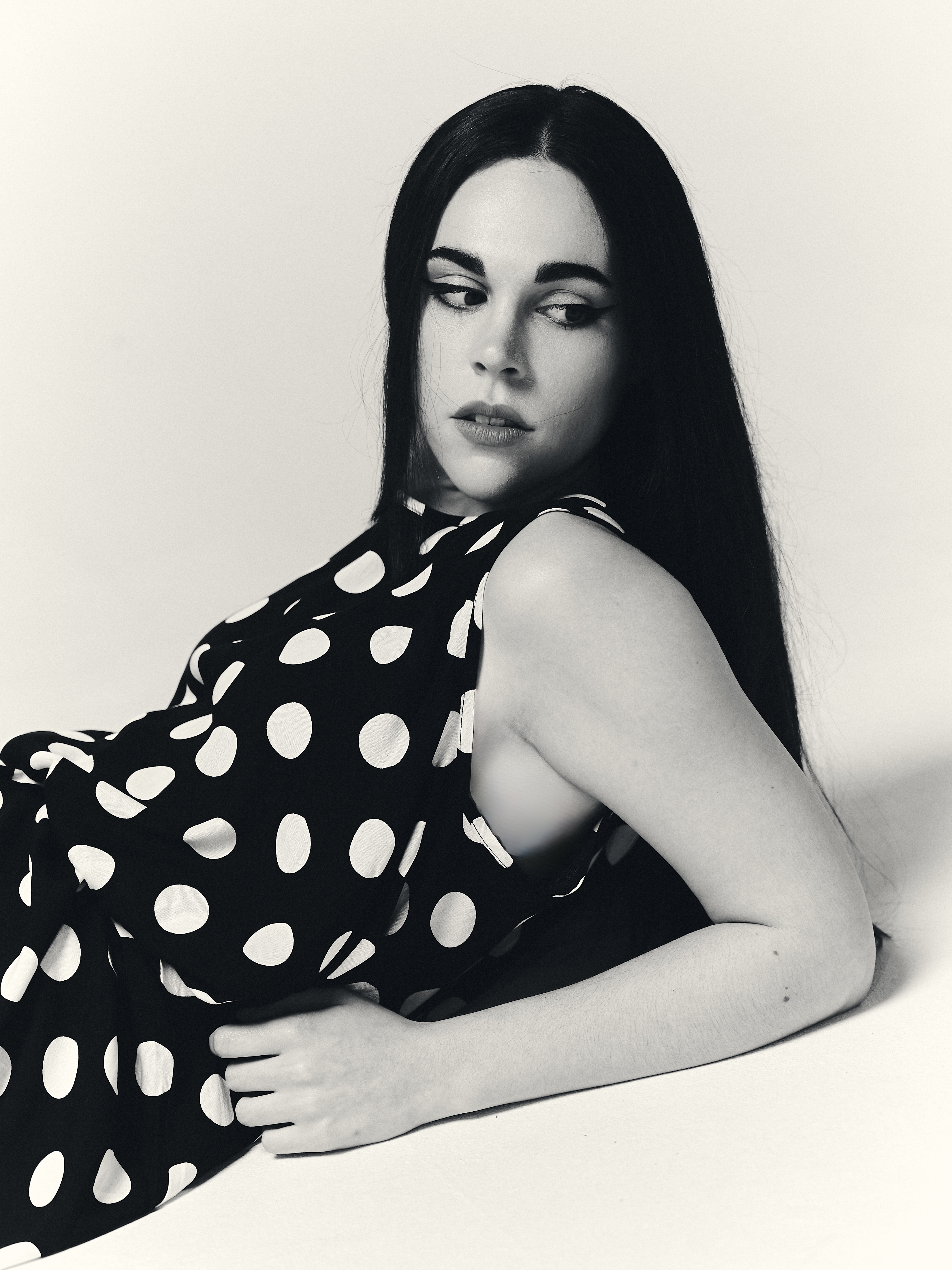 Studio fashion editorial with polka dot dress and minimalist visual narrative