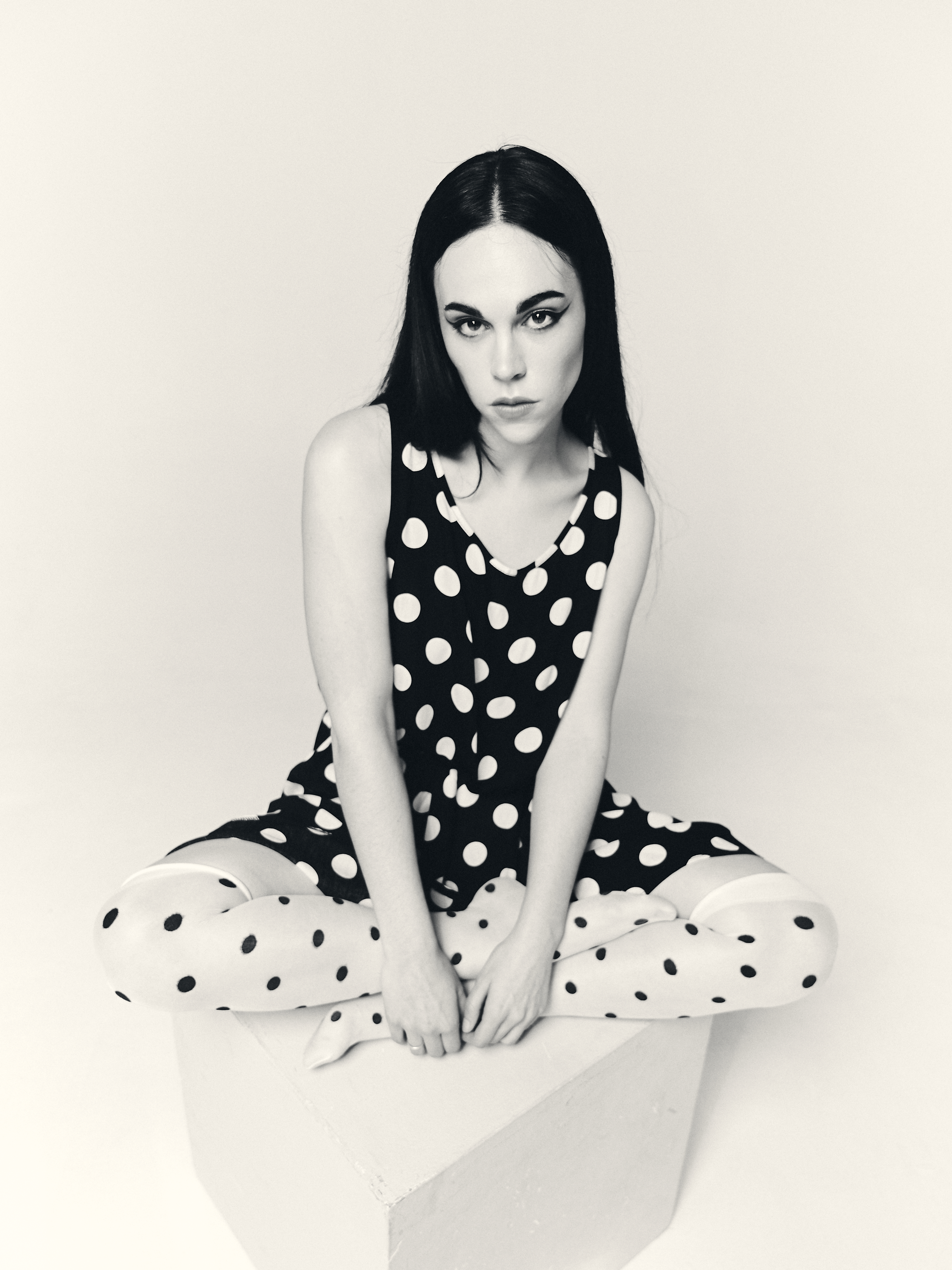 Artistic black and white portrait with polka dot pattern and editorial direction