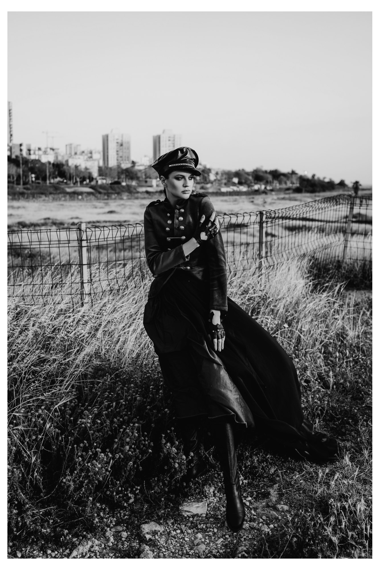 Women wearing structured military jackets, corsets, dramatic crinolines and peaked caps in a fashion editorial