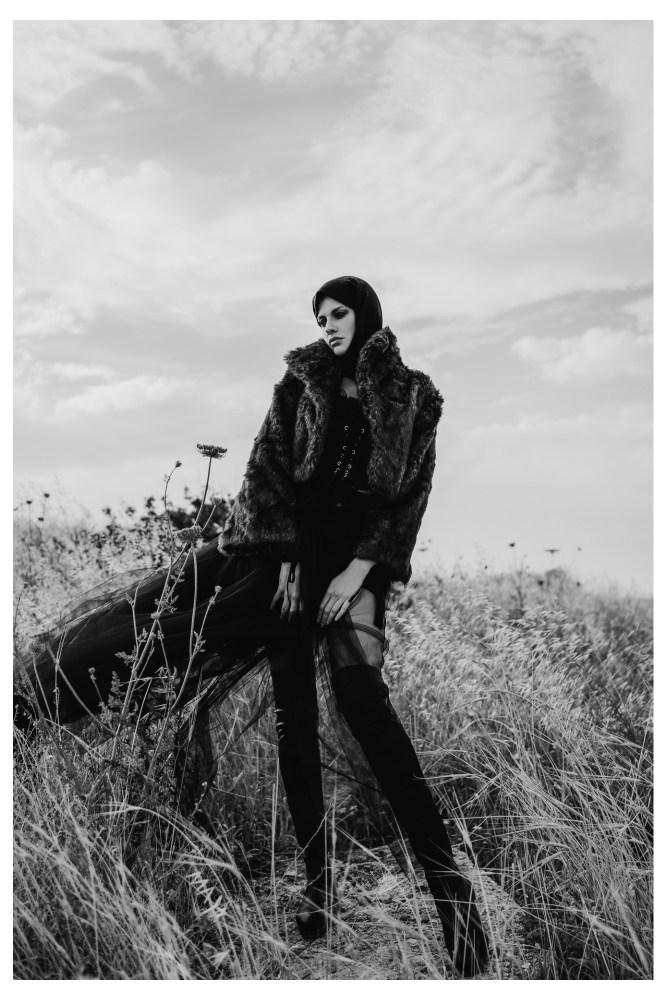 A woman wearing a structured military jacket in a fashion editorial
